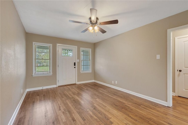 entryway with ceiling fan and light hardwood / wood-style flooring