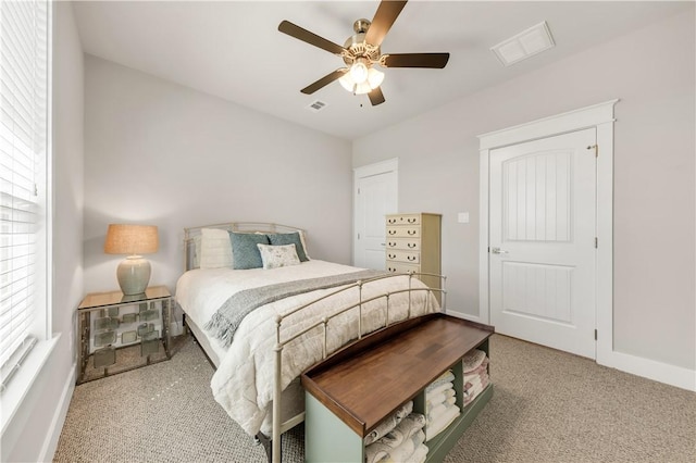 15658 Long Creek Ln, College Station, TX 77845 - bedroom with ceiling fan, multiple windows, visible vents, and baseboards
