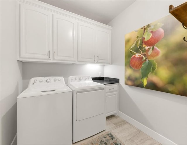 15658 Long Creek Ln, College Station, TX 77845 - clothes washing area featuring washing machine and dryer, cabinet space, and baseboards