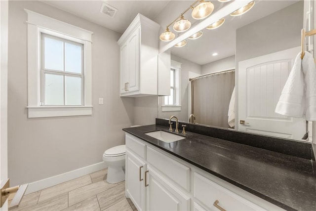 15658 Long Creek Ln, College Station, TX 77845 - bathroom with toilet, a shower with shower curtain, visible vents, vanity, and baseboards