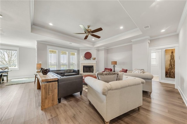 15658 Long Creek Ln, College Station, TX 77845 - living room with light wood-type flooring, visible vents, and a raised ceiling