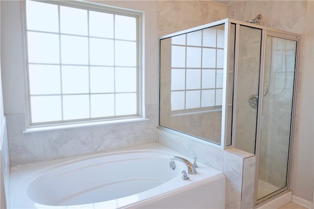 2011 Stubbs Dr, Bryan, TX 77807 - full bathroom with a shower stall, a bath, and healthy amount of natural light
