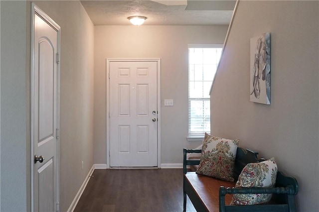 2011 Stubbs Dr, Bryan, TX 77807 - entrance foyer with plenty of natural light, dark wood-style floors, and baseboards