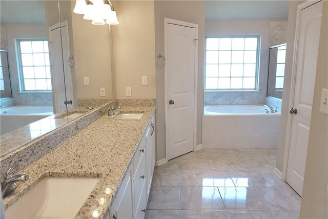 2011 Stubbs Dr, Bryan, TX 77807 - full bath featuring healthy amount of natural light, double vanity, a bath, and a shower with door