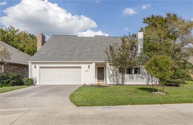 view of front facade featuring concrete driveway, a chimney, an attached garage, and a front yard