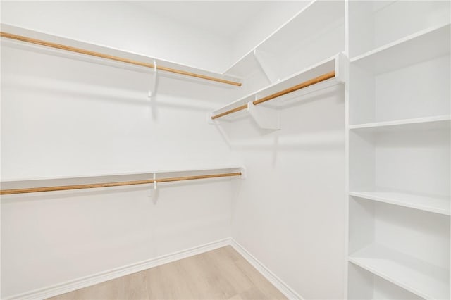 spacious closet with light wood-style floors