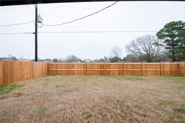 view of yard with a fenced backyard