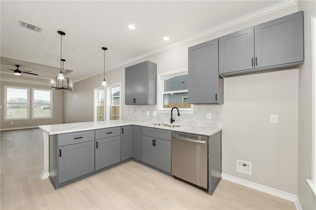 kitchen featuring visible vents, gray cabinets, dishwasher, and a peninsula