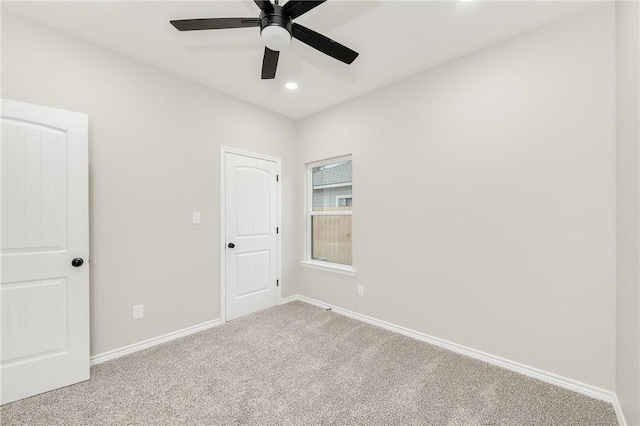 empty room featuring carpet flooring, recessed lighting, baseboards, and ceiling fan