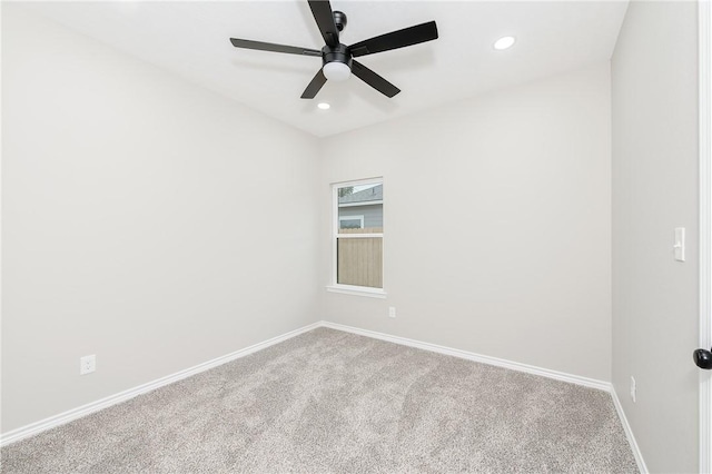 carpeted empty room with recessed lighting, a ceiling fan, and baseboards