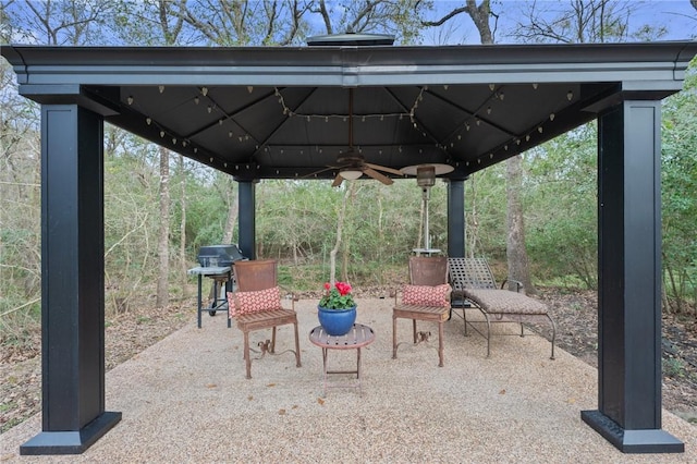 view of patio with a gazebo, ceiling fan, and a grill