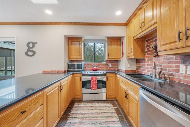 kitchen featuring decorative backsplash, crown molding, sink, and appliances with stainless steel finishes