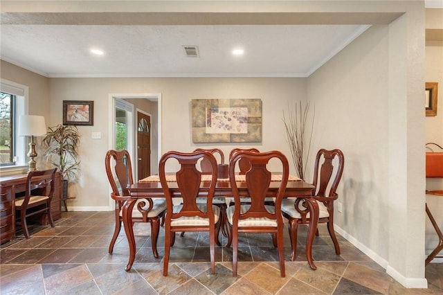 dining area with ornamental molding