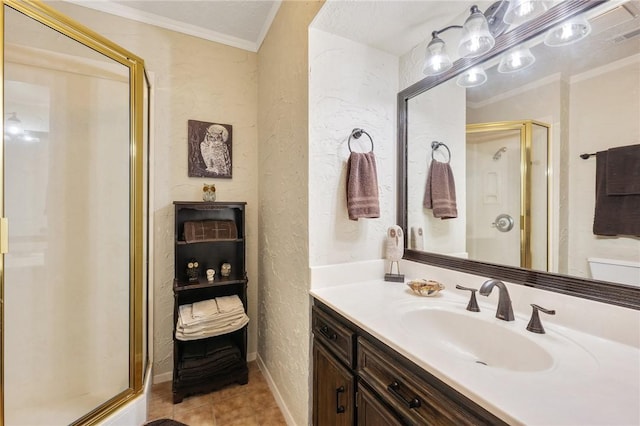 bathroom featuring tile patterned flooring, vanity, a shower with shower door, and ornamental molding