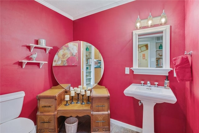 bathroom featuring toilet and ornamental molding