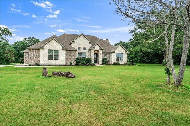 view of front of house with a front lawn