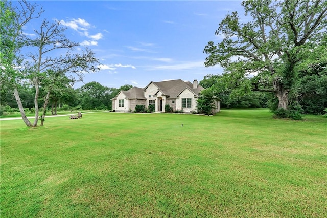 view of front of home featuring a front lawn