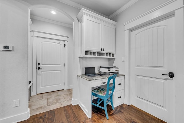 office space with wood-type flooring and ornamental molding