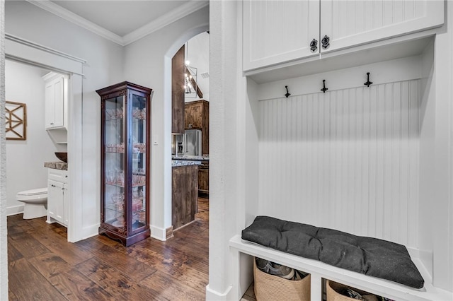 mudroom featuring crown molding and dark hardwood / wood-style floors