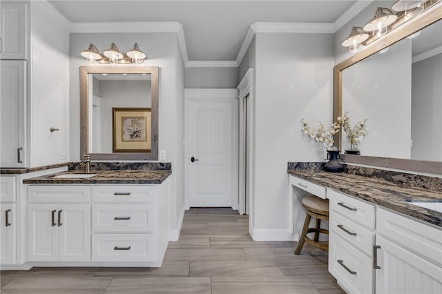 bathroom with vanity and crown molding