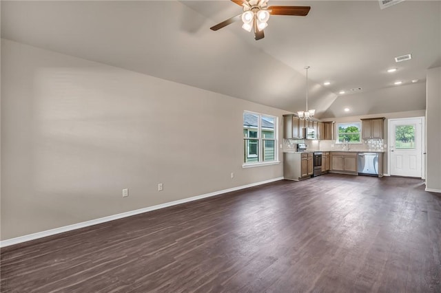 unfurnished living room featuring visible vents, baseboards, dark wood-style floors, lofted ceiling, and ceiling fan with notable chandelier