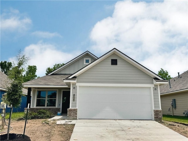 1204 Highgarden Dr, Navasota, TX 77868 - craftsman-style house featuring a garage, board and batten siding, driveway, and stone siding