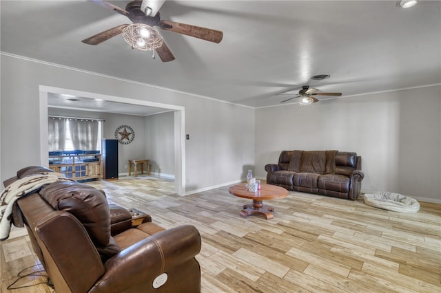 living room with ceiling fan and light hardwood / wood-style floors