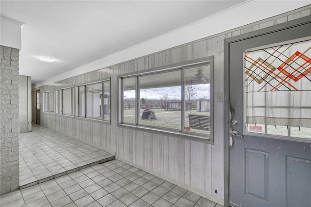 tiled entryway with ornamental molding