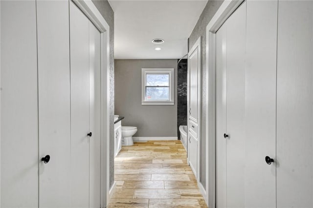 bathroom with vanity, wood-type flooring, and toilet