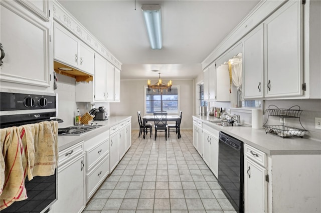 kitchen with sink, crown molding, black appliances, white cabinets, and decorative light fixtures