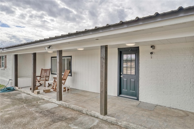 entrance to property with a patio area