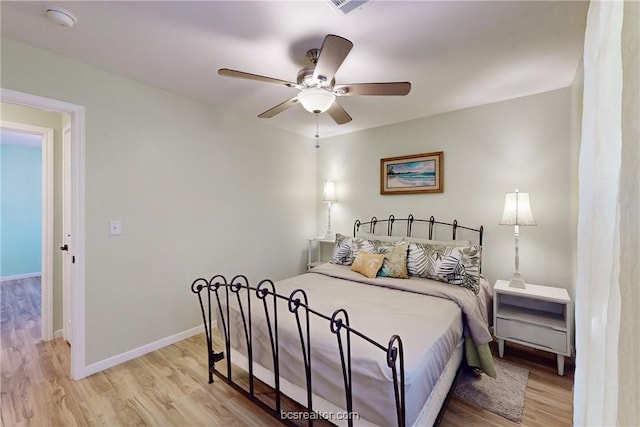 bedroom featuring light hardwood / wood-style floors and ceiling fan