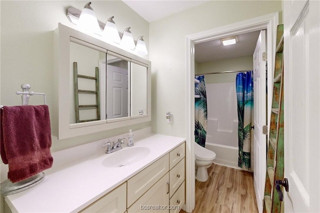 full bathroom with vanity, toilet, wood-type flooring, and shower / bath combo