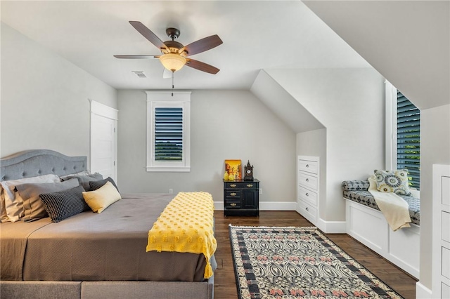 10560 St John Dr, Iola, TX 77861 - bedroom with dark wood-style floors, ceiling fan, and baseboards