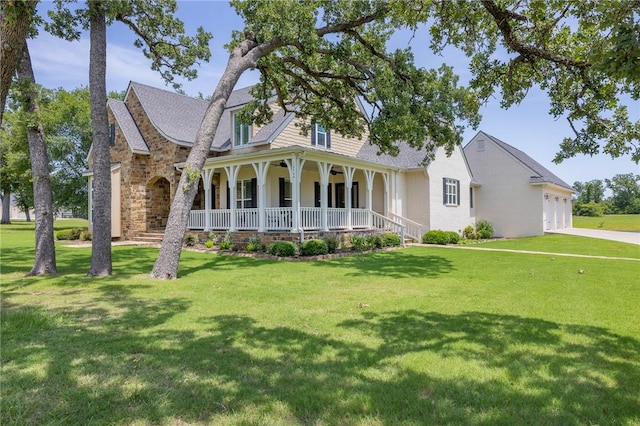 10560 St John Dr, Iola, TX 77861 - view of front of home with a porch, a front lawn, a garage, and driveway