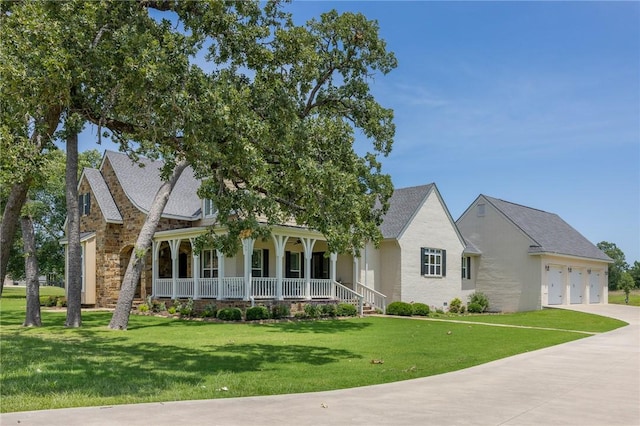 10560 St John Dr, Iola, TX 77861 - view of front facade featuring covered porch, a front lawn, driveway, and stone siding