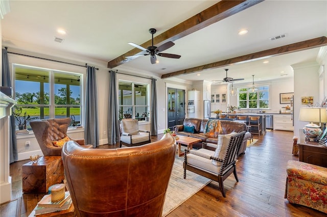 10560 St John Dr, Iola, TX 77861 - living room with ceiling fan, crown molding, beamed ceiling, dark wood-style floors, and recessed lighting