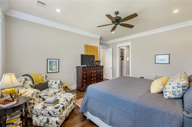 10560 St John Dr, Iola, TX 77861 - bedroom with dark wood-style flooring, crown molding, recessed lighting, ceiling fan, and baseboards