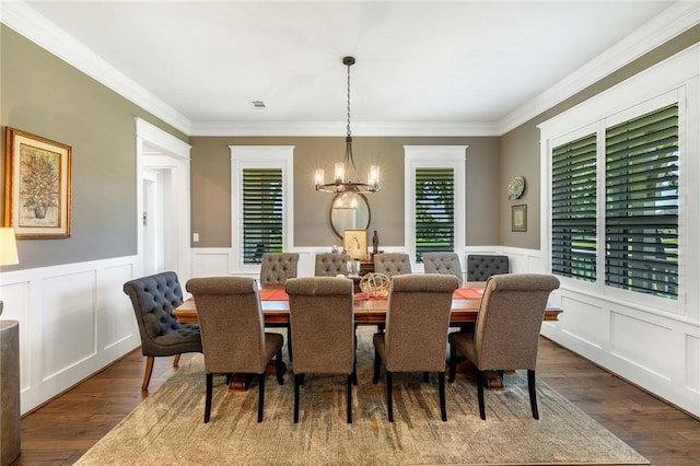 10560 St John Dr, Iola, TX 77861 - dining room with a chandelier, dark wood-style flooring, a decorative wall, ornamental molding, and wainscoting