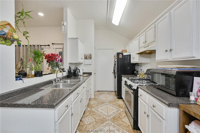 kitchen featuring lofted ceiling, black appliances, sink, light tile patterned flooring, and white cabinetry