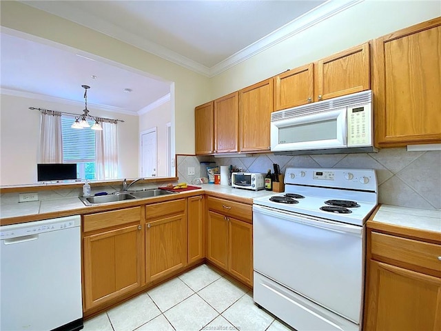 801 Luther St W Unit 401, College Station, TX 77840 - kitchen featuring white appliances, a sink, ornamental molding, backsplash, and a chandelier