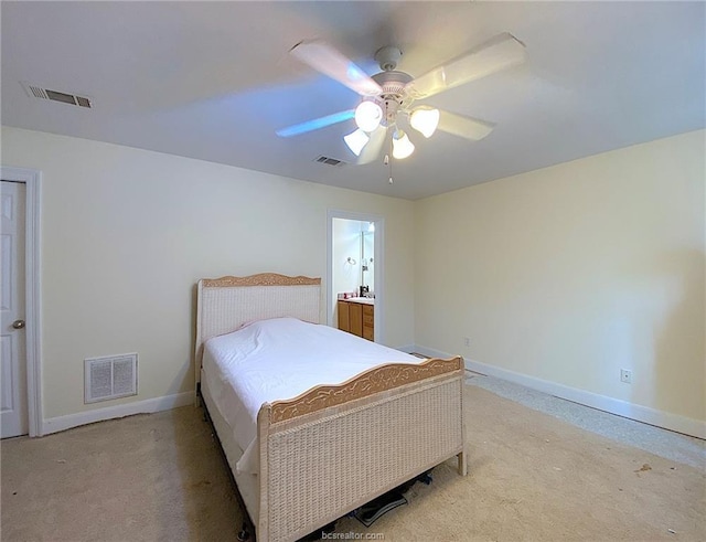 801 Luther St W Unit 401, College Station, TX 77840 - bedroom featuring baseboards, light carpet, and a ceiling fan