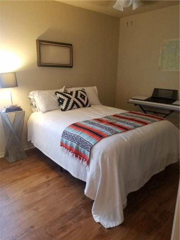 bedroom featuring wood finished floors