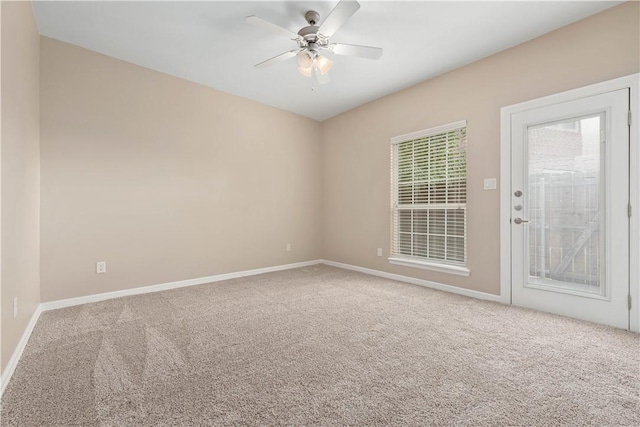 unfurnished room with carpet and ceiling fan