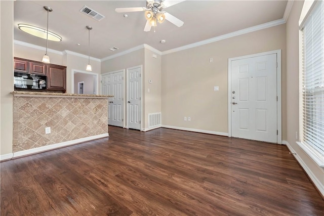 kitchen with dark hardwood / wood-style floors, ceiling fan, and crown molding