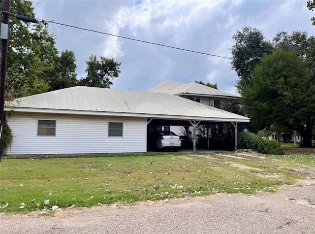 view of side of home featuring a yard