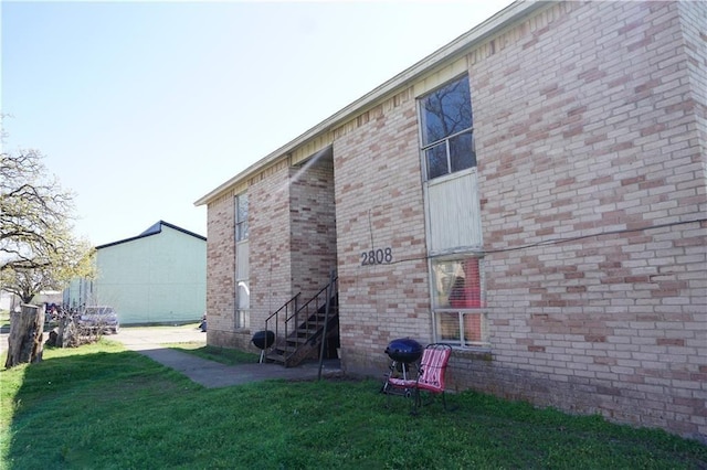 view of home's exterior featuring a lawn