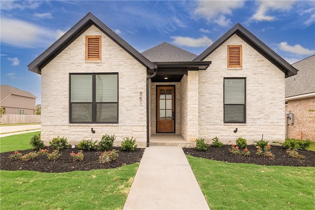 881 Double Mountain Rd, College Station, TX 77845 - view of front of house featuring a front yard and roof with shingles