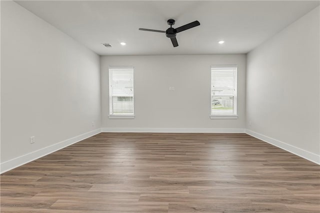 881 Double Mountain Rd, College Station, TX 77845 - empty room with healthy amount of natural light, a ceiling fan, recessed lighting, and baseboards
