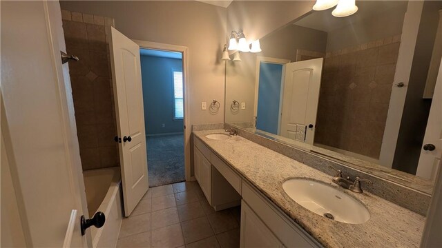 full bathroom featuring tile patterned flooring and double vanity